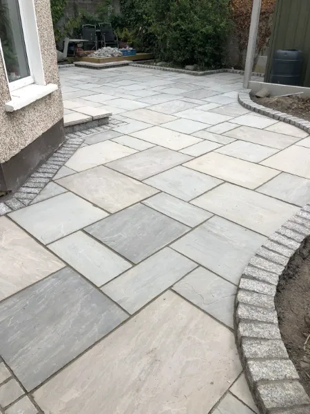 Elegant sandstone patio design in a Dublin garden