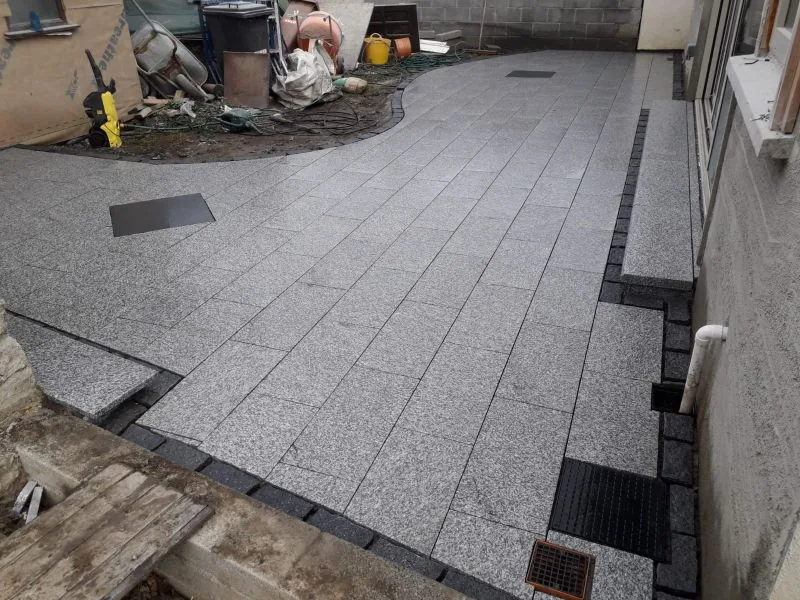 Granite patio preparation during paving work in Dublin